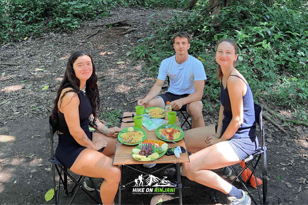 Hikers enjoying a meal with mountain views